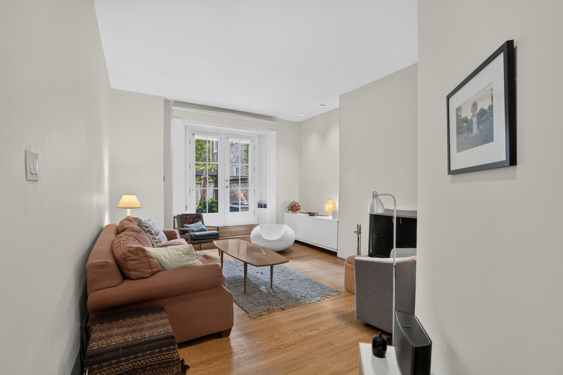 First floor living room with french doors opening to the rear garden