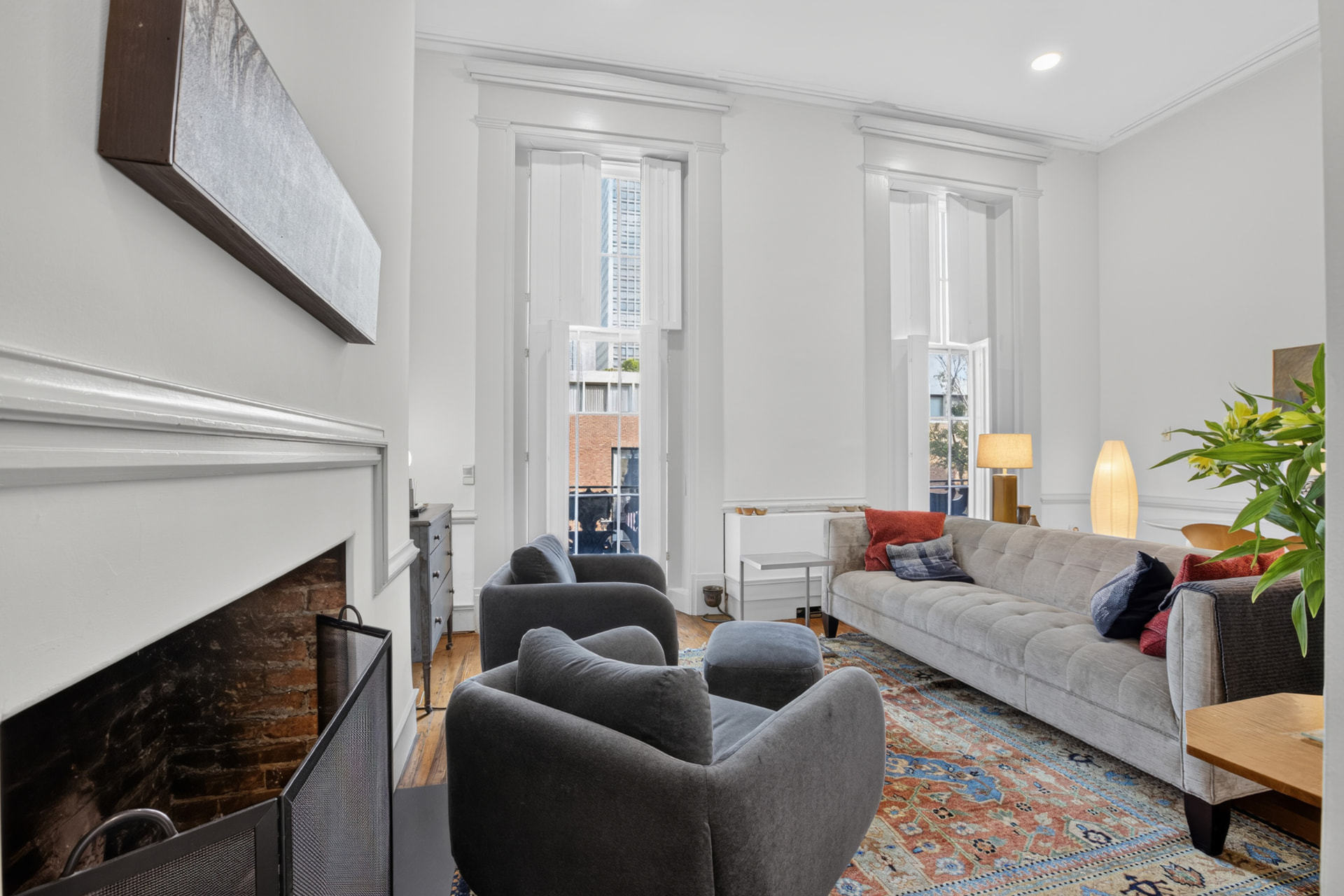 First floor parlor with soaring ceilings, tall shuttered windows and terrace access